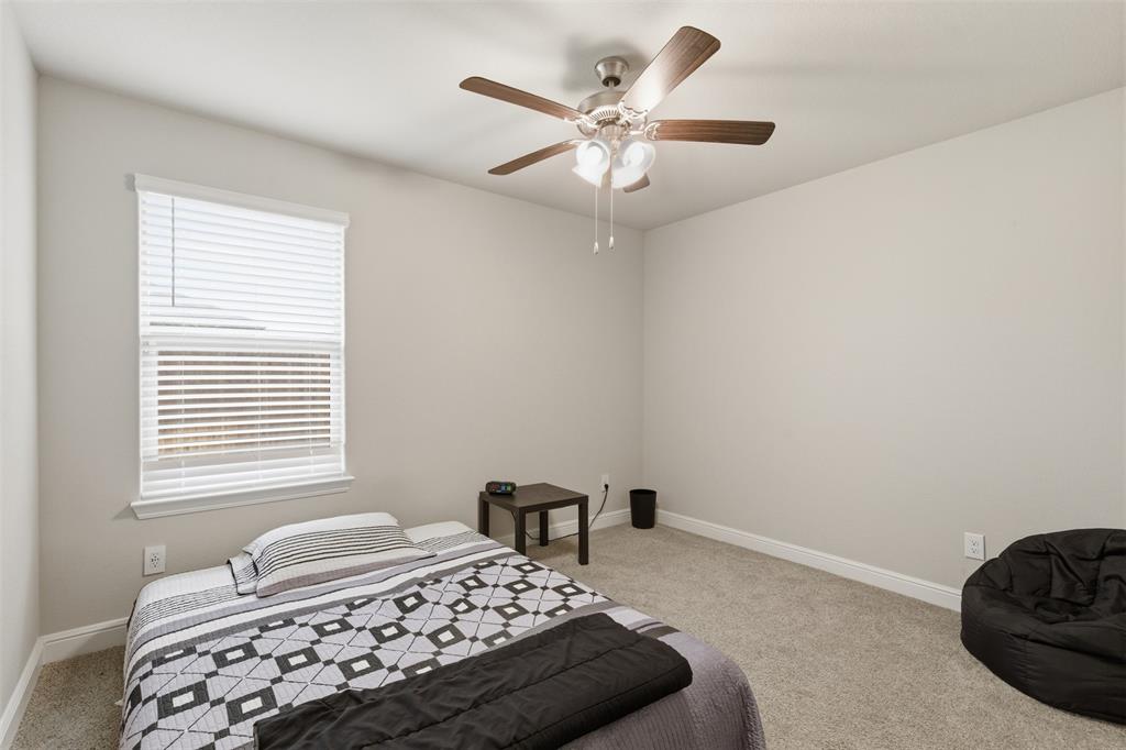 333 Alice Harney Road Burleson, TX 76028 - Photo 28 of 36 a bedroom with a bed and a window