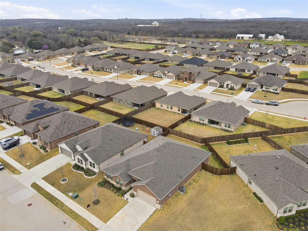 333 Alice Harney Road Burleson, TX 76028 - Photo 34 of 36 an aerial view of residential houses with outdoor space