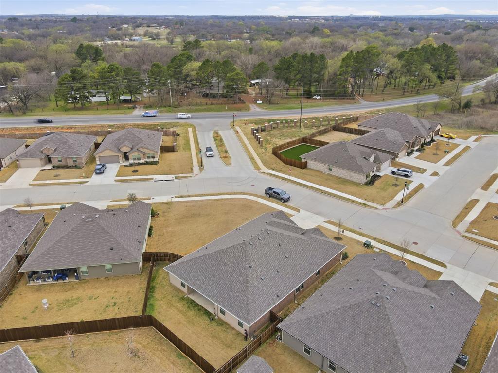 333 Alice Harney Road Burleson, TX 76028 - Photo 36 of 36 a view of a swimming pool with an outdoor seating