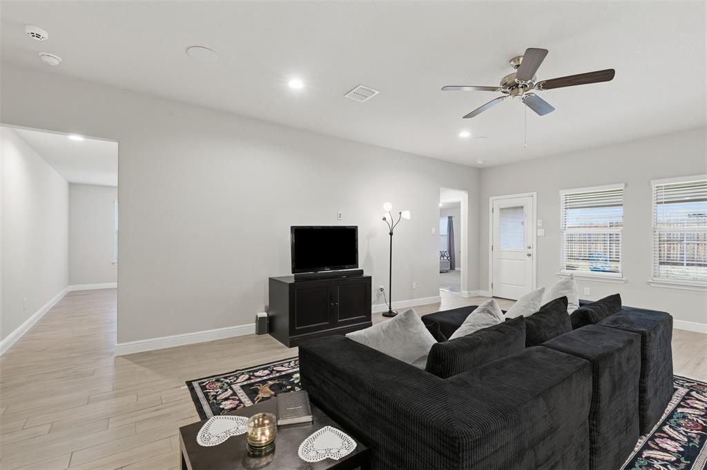 333 Alice Harney Road Burleson, TX 76028 - Photo 5 of 36 a living room with furniture and a flat screen tv