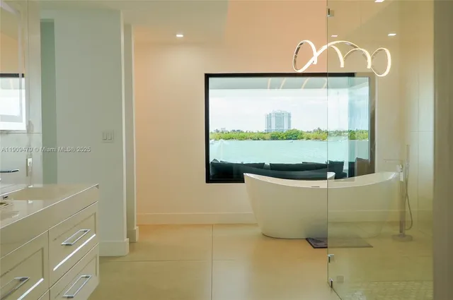 a bathroom with a tub and window