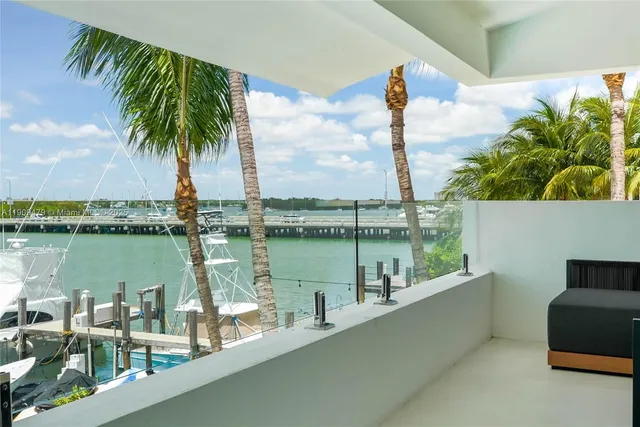 a view of a lake with a palm tree and a lake view