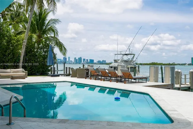 a view of a swimming pool with a patio