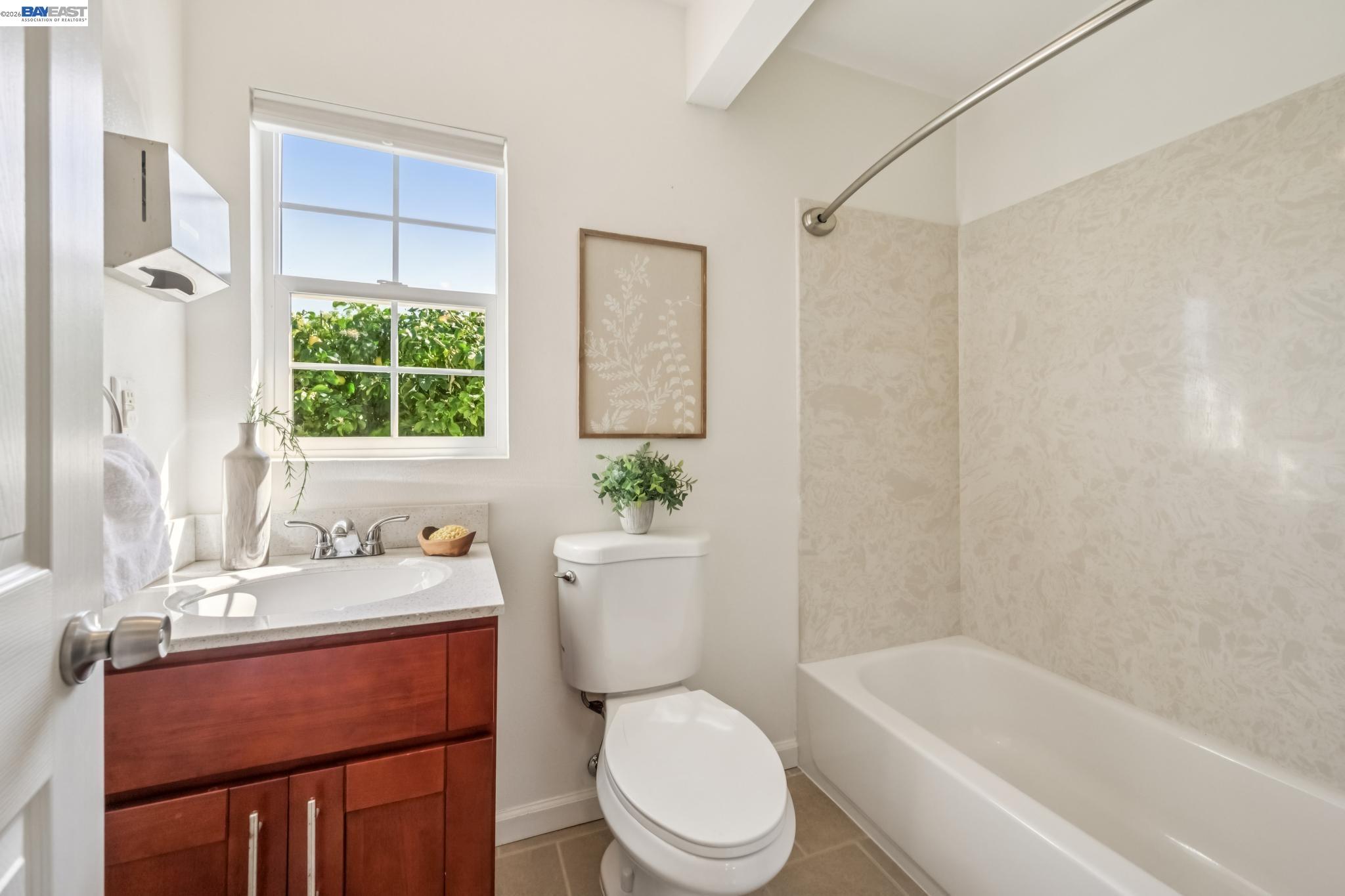 21132 Tyee Court Castro Valley, CA 94546 - Photo 28 of 60 a bathroom with a sink a toilet a tub and shower