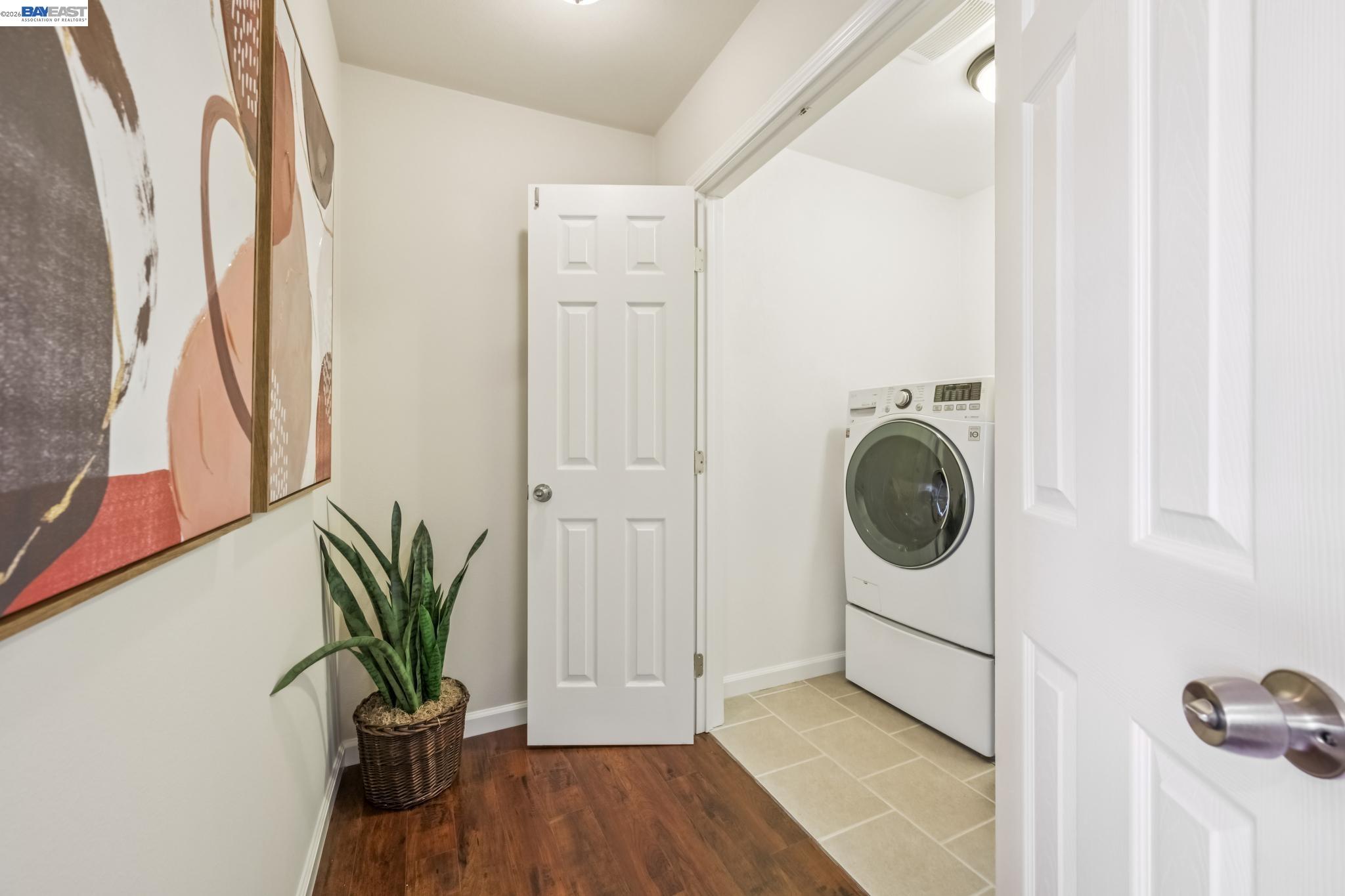21132 Tyee Court Castro Valley, CA 94546 - Photo 29 of 60 a view of a hallway with washer and dryer