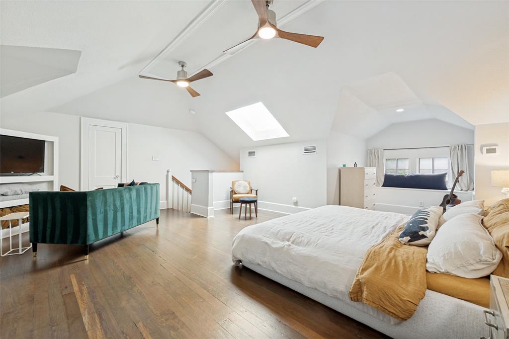 5235 Goodwin Avenue Dallas, TX 75206 - Photo 19 of 31 a bedroom with a bed and a television