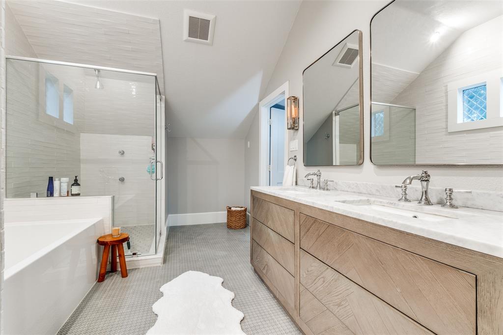 5235 Goodwin Avenue Dallas, TX 75206 - Photo 21 of 31 a spacious bathroom with a double vanity sink mirror and bathtub