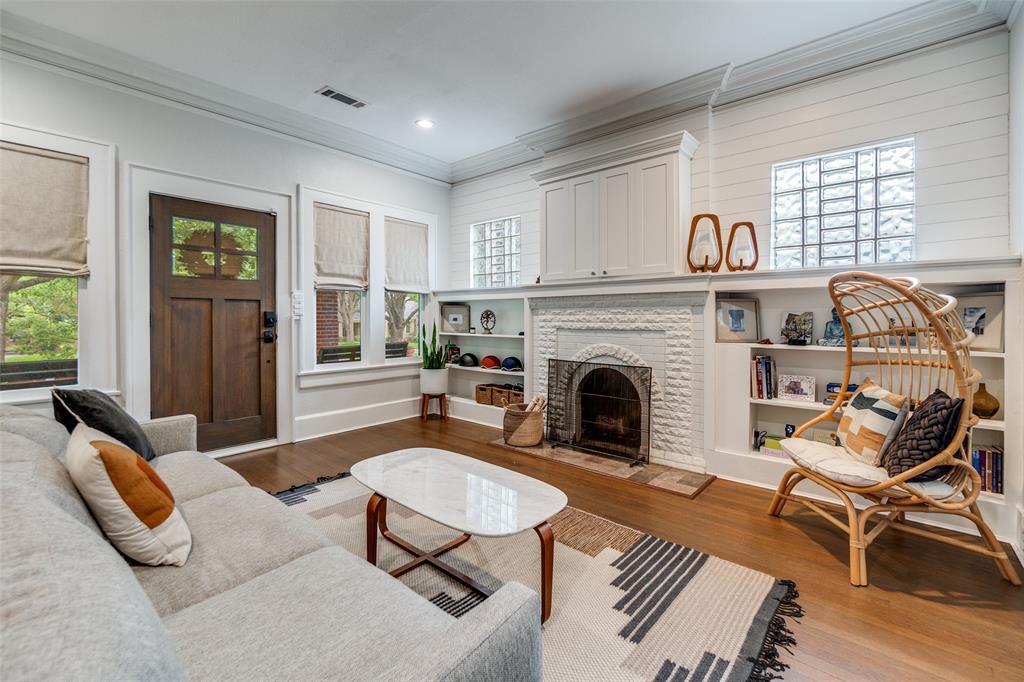 5235 Goodwin Avenue Dallas, TX 75206 - Photo 5 of 31 a living room with furniture and a fireplace