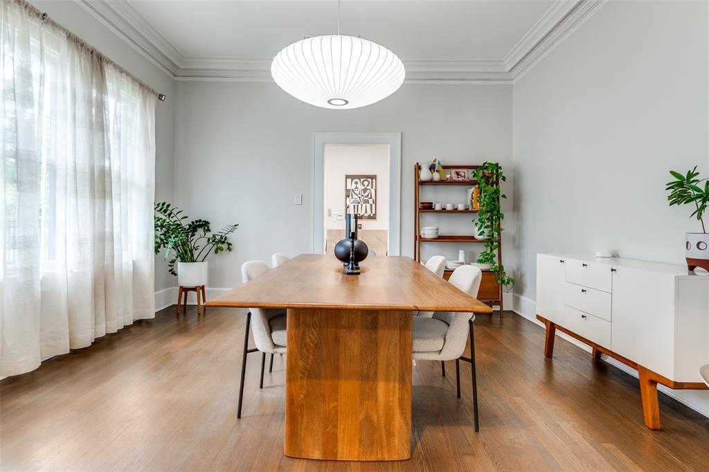 5235 Goodwin Avenue Dallas, TX 75206 - Photo 6 of 31 a view of a dining room with furniture and wooden floor