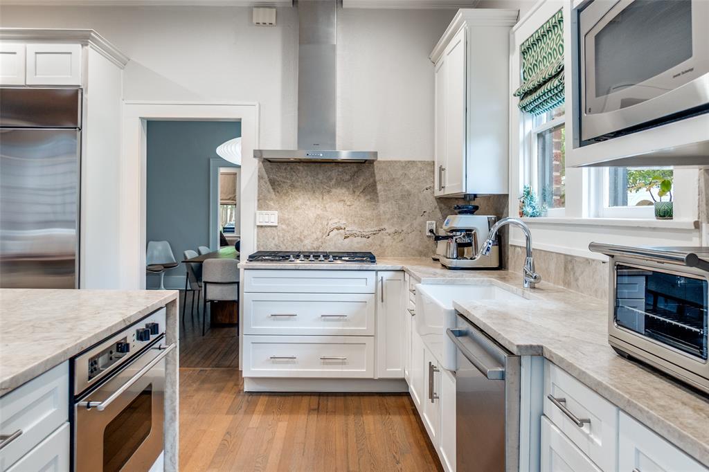 5235 Goodwin Avenue Dallas, TX 75206 - Photo 9 of 31 a kitchen with a stove oven and sink