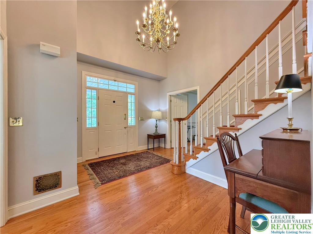 1997 West Point Drive Bethlehem, PA 18015 - Photo 12 of 94 a view of an entryway with wooden floor and a chandelier