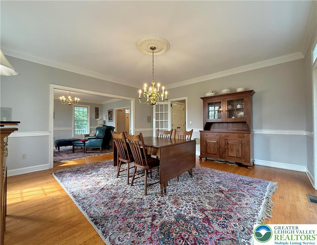 1997 West Point Drive Bethlehem, PA 18015 - Photo 24 of 94 a living room with furniture and a chandelier
