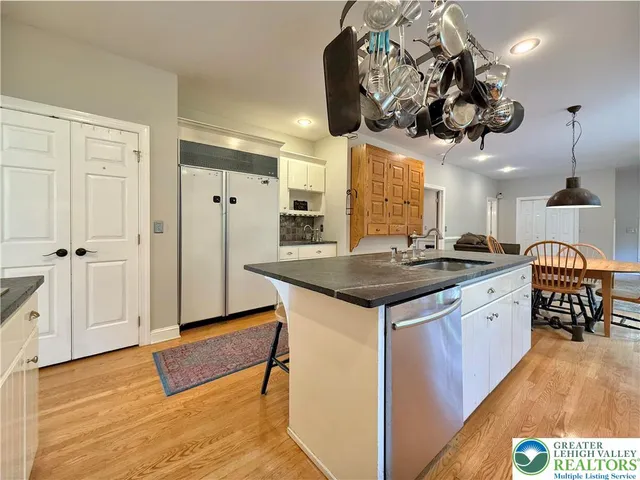 a bedroom with a bed and dresser