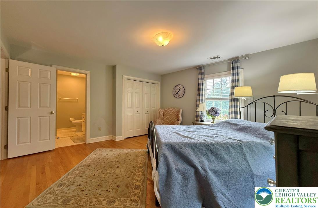 1997 West Point Drive Bethlehem, PA 18015 - Photo 49 of 94 a bedroom with a bed and a dresser with mirror