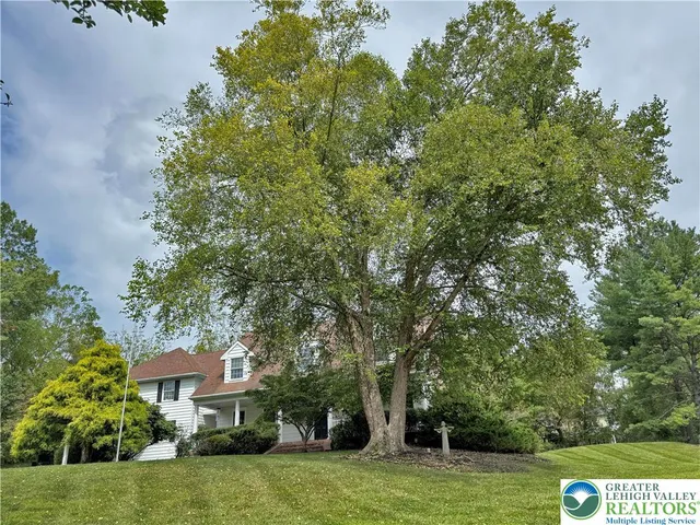 a view of an entryway with wooden floor and a chandelier