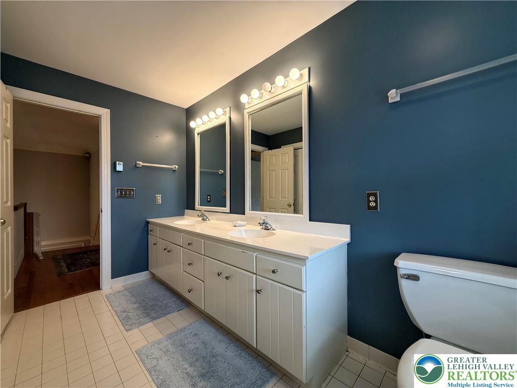 1997 West Point Drive Bethlehem, PA 18015 - Photo 70 of 94 a spacious bathroom with a toilet sink and mirror
