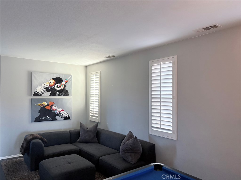 2729 Hornbeam Road Palmdale, CA 93551 - Photo 3 of 35 a living room with furniture and a window