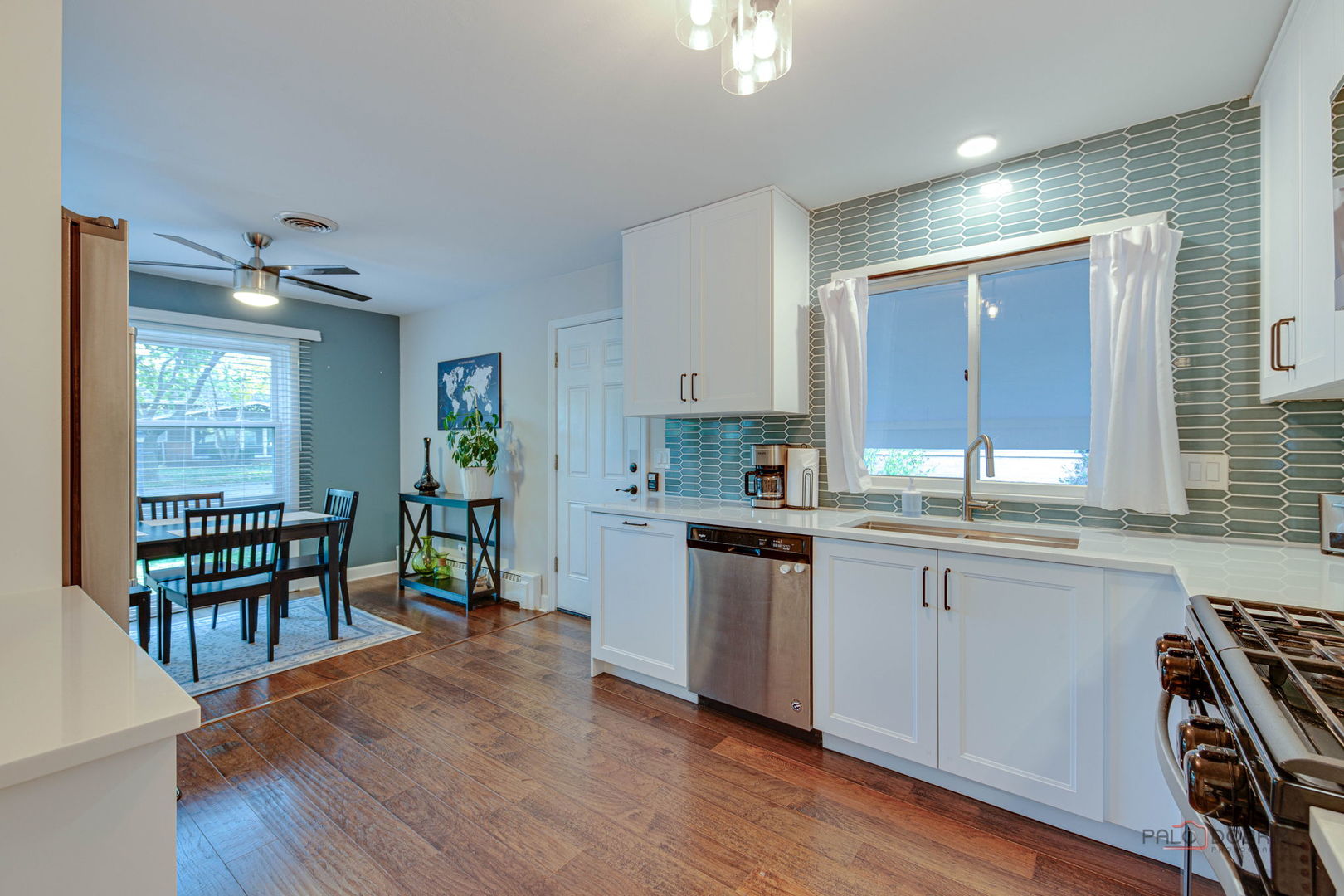 512 Lisa Road West Dundee, IL 60118 - Photo 6 of 31 a kitchen with stainless steel appliances granite countertop wooden cabinets a stove a sink and a large window