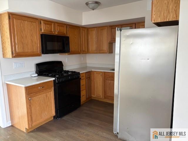 327 Leon Avenue, Unit 1 Perth Amboy, NJ 08861 - Photo 11 of 20 a kitchen with a refrigerator stove and microwave