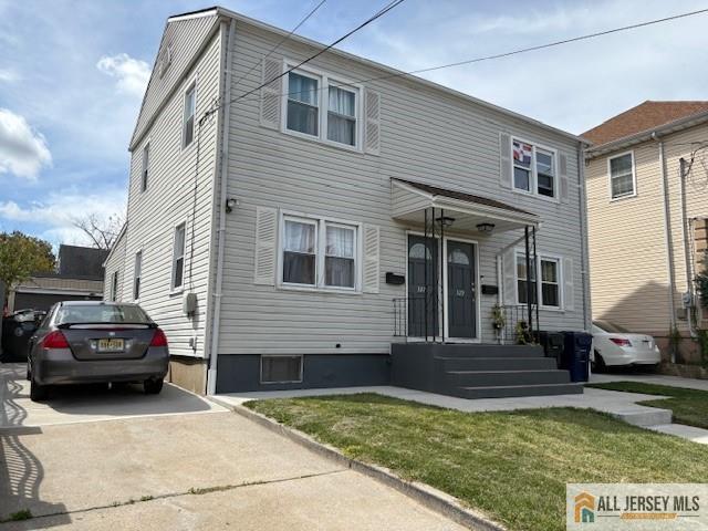327 Leon Avenue, Unit 1 Perth Amboy, NJ 08861 - Photo 2 of 20 a view of a car parked in front of a house