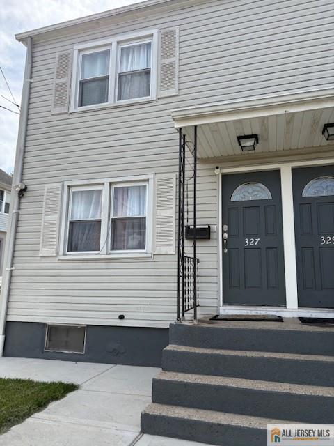 327 Leon Avenue, Unit 1 Perth Amboy, NJ 08861 - Photo 4 of 20 a front view of a house with a window