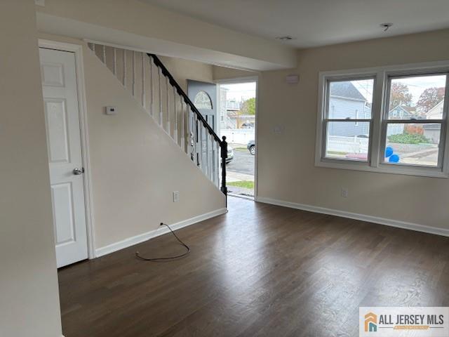 327 Leon Avenue, Unit 1 Perth Amboy, NJ 08861 - Photo 8 of 20 wooden floor in an empty room with a window