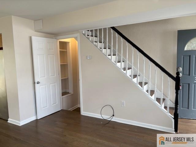 327 Leon Avenue, Unit 1 Perth Amboy, NJ 08861 - Photo 9 of 20 a view of a livingroom with wooden floor and stairs