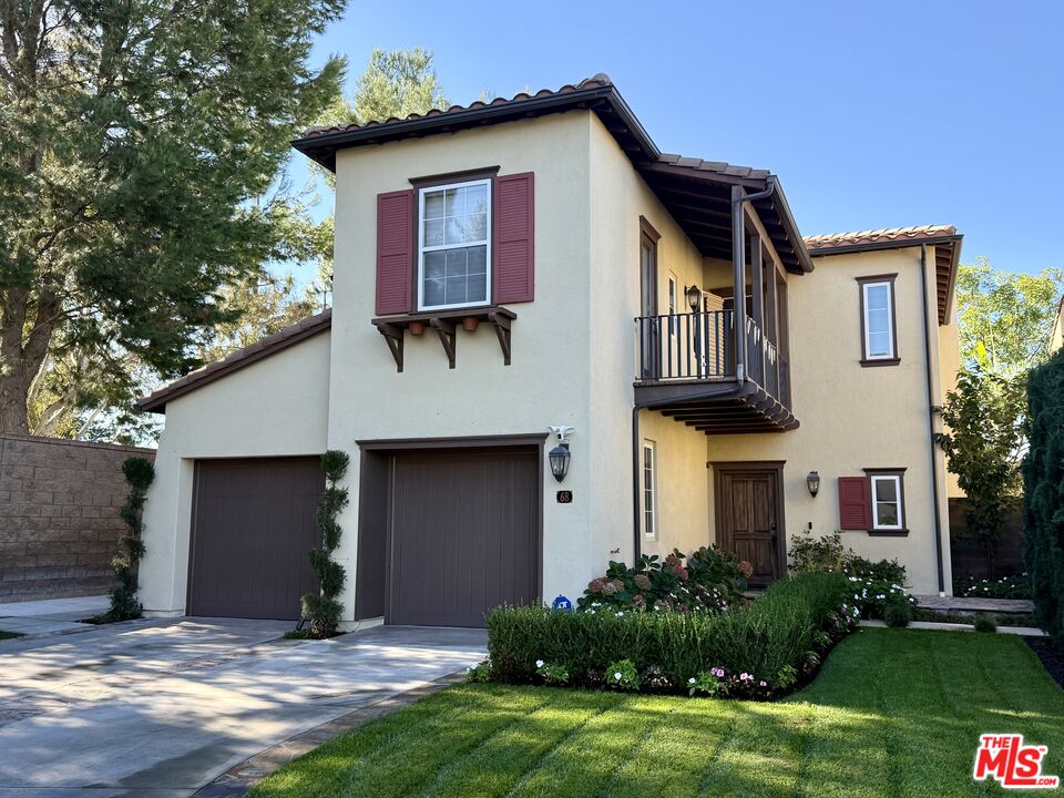 68 Cornflower Irvine, CA 92620 - Photo 2 of 21 a front view of a house with garden