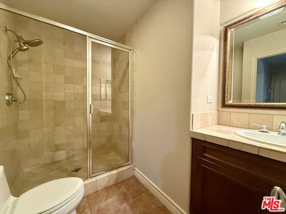 68 Cornflower Irvine, CA 92620 - Photo 6 of 21 a bathroom with a sink and a mirror