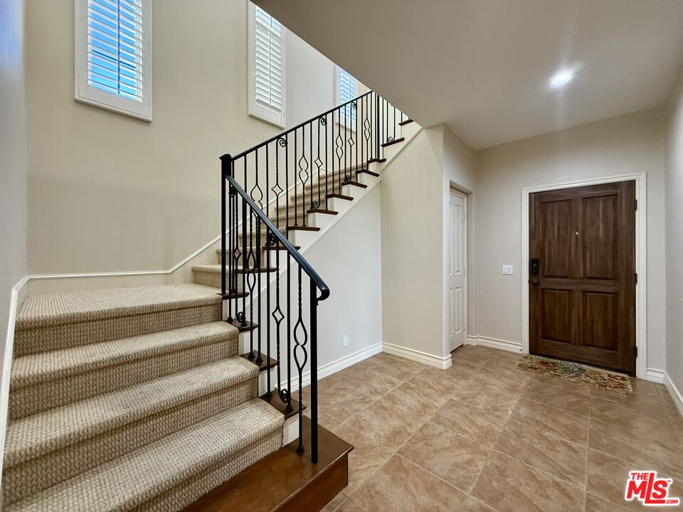 68 Cornflower Irvine, CA 92620 - Photo 7 of 21 a view of entryway and hall with wooden floor
