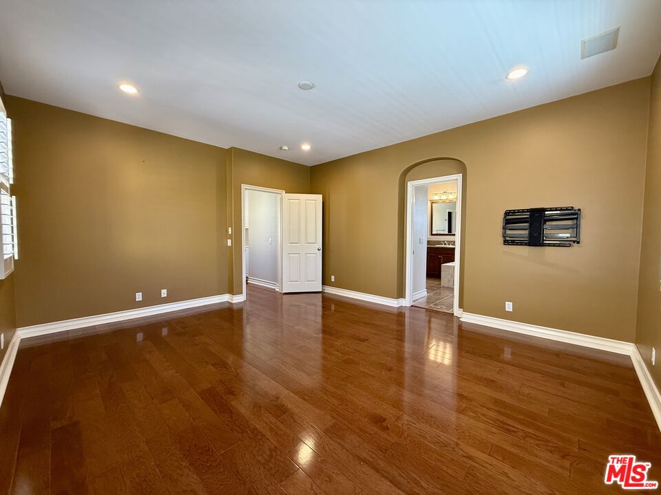 68 Cornflower Irvine, CA 92620 - Photo 10 of 21 a view of an empty room with wooden floor