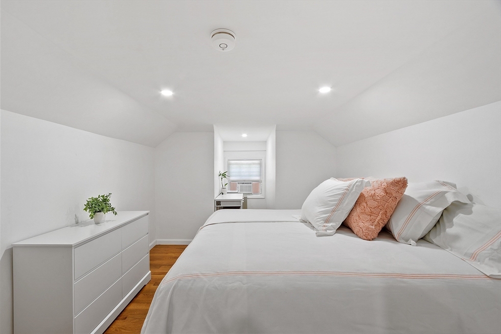 10 Burnham Road Andover, MA 01810 - Photo 12 of 25 a bedroom with a bed and window