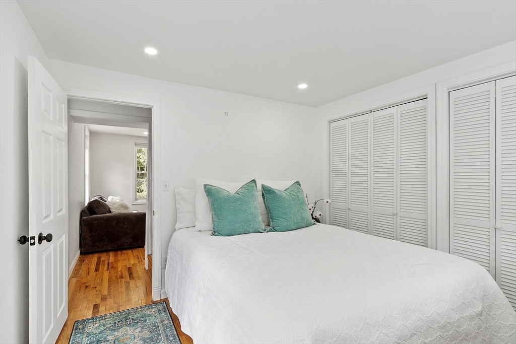 10 Burnham Road Andover, MA 01810 - Photo 15 of 25 a bedroom with a bed and a couch