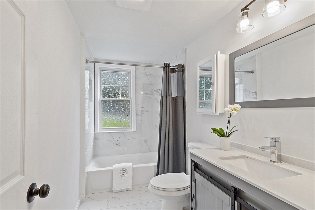 10 Burnham Road Andover, MA 01810 - Photo 16 of 25 a bathroom with a granite countertop sink toilet and shower