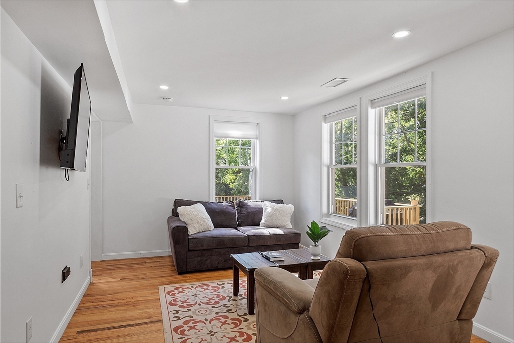 10 Burnham Road Andover, MA 01810 - Photo 17 of 25 a living room with furniture and a flat screen tv