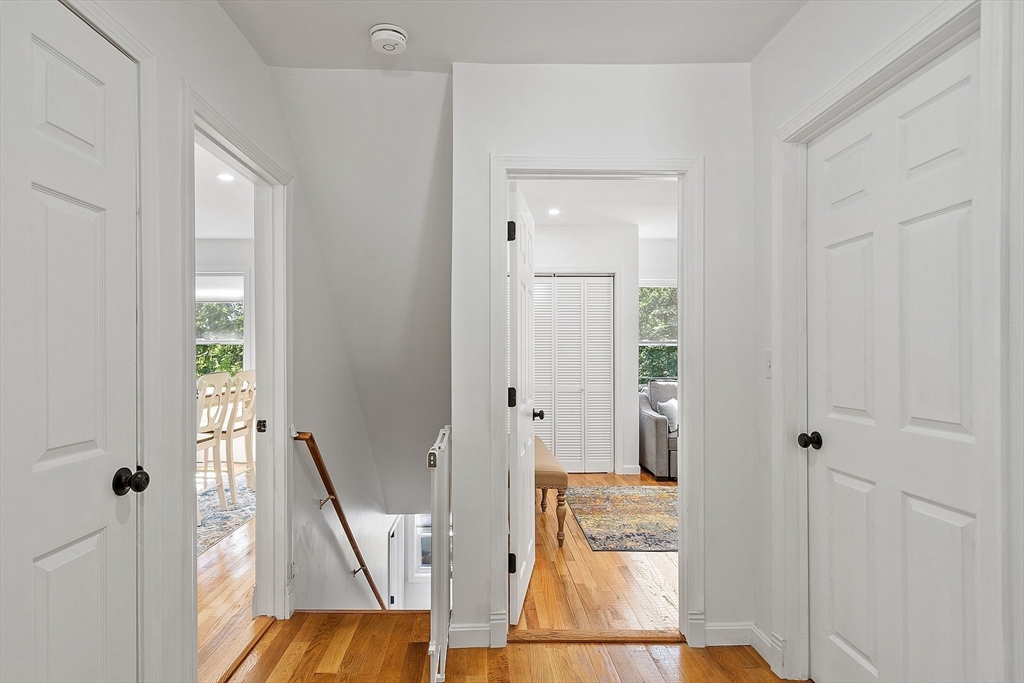 10 Burnham Road Andover, MA 01810 - Photo 9 of 25 a view of a hallway with wooden floor and entryway