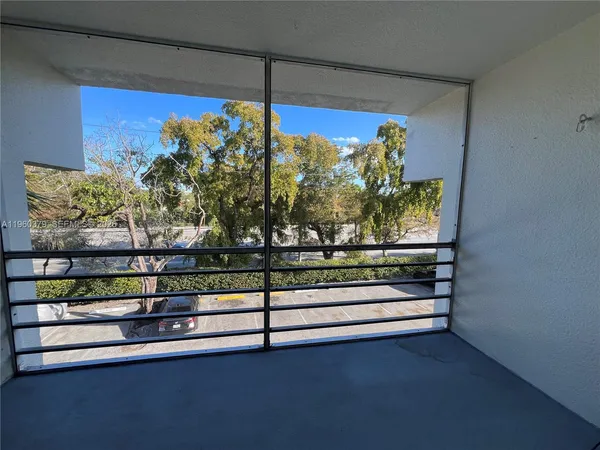 a view of balcony with a potted plant