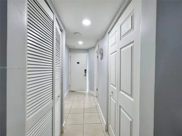a view of a hallway with a white door