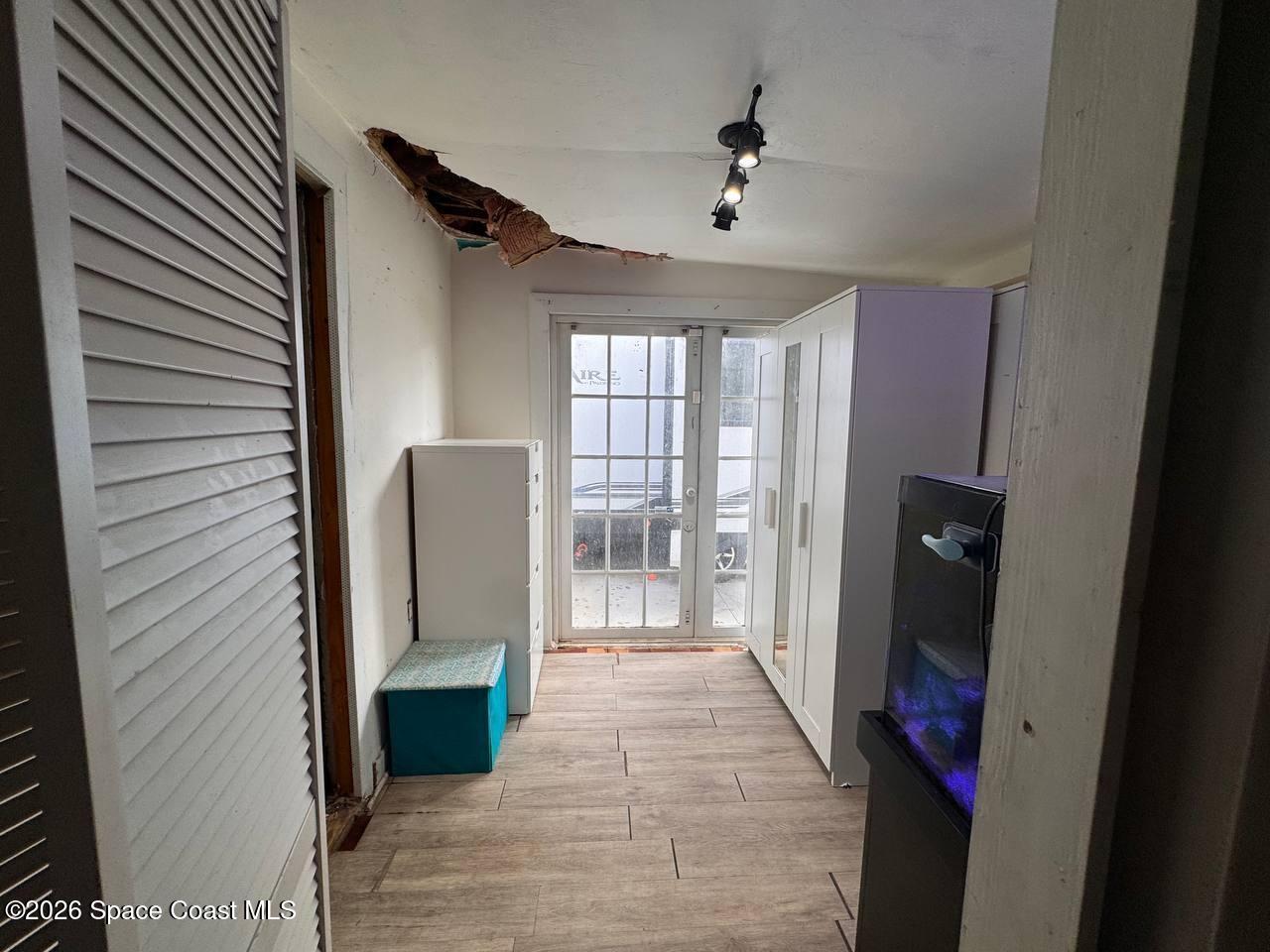 1340 Northwest 112th Street Miami, FL 33167 - Photo 11 of 20 a view of a hallway with wooden shelves