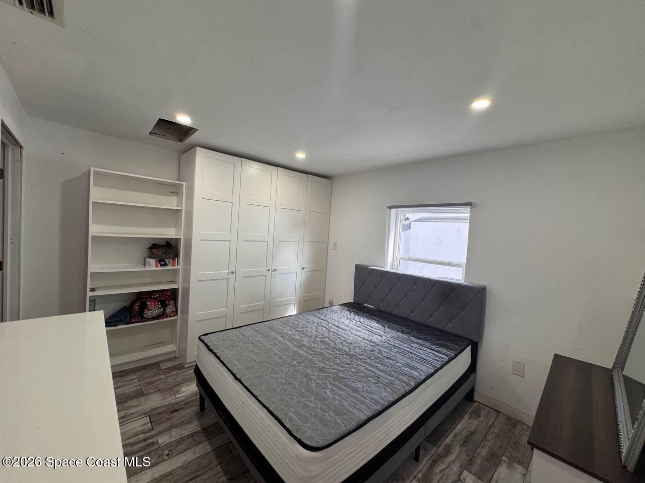 1340 Northwest 112th Street Miami, FL 33167 - Photo 12 of 20 a bedroom with a bed and a dresser