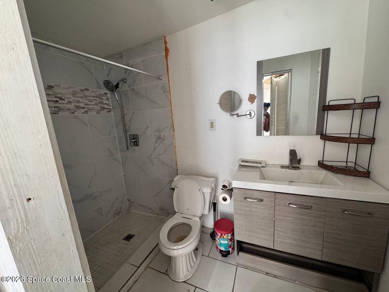 1340 Northwest 112th Street Miami, FL 33167 - Photo 15 of 20 a bathroom with a sink toilet and shower