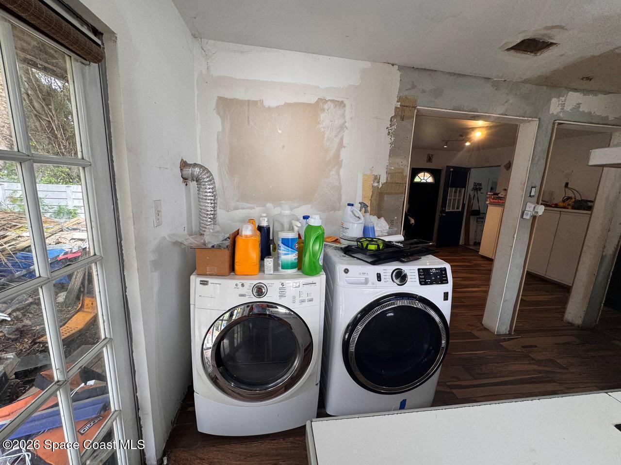 1340 Northwest 112th Street Miami, FL 33167 - Photo 17 of 20 a view of a storage and utility room with washer and dryer