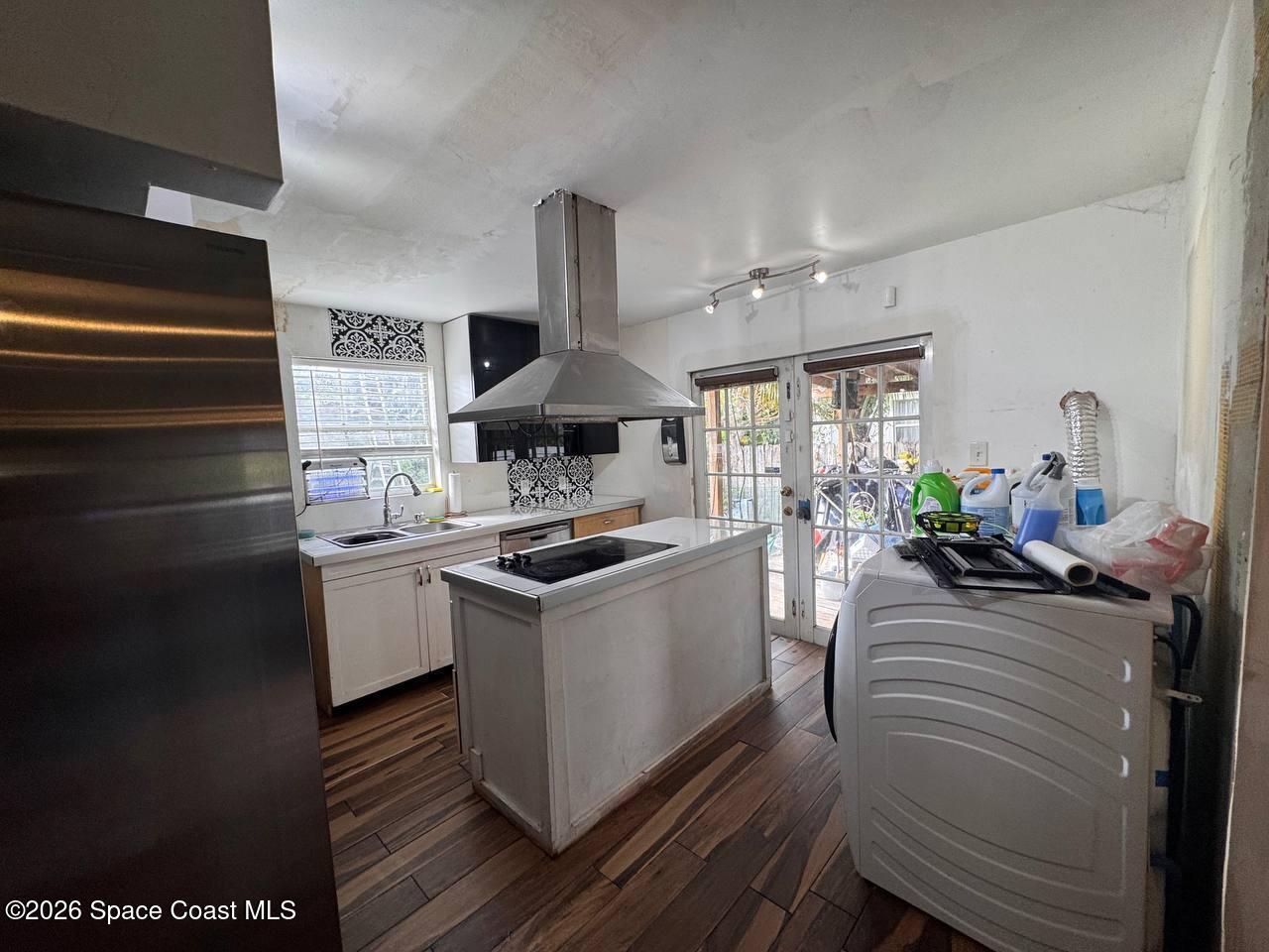 1340 Northwest 112th Street Miami, FL 33167 - Photo 3 of 20 a kitchen with a sink stove and cabinets