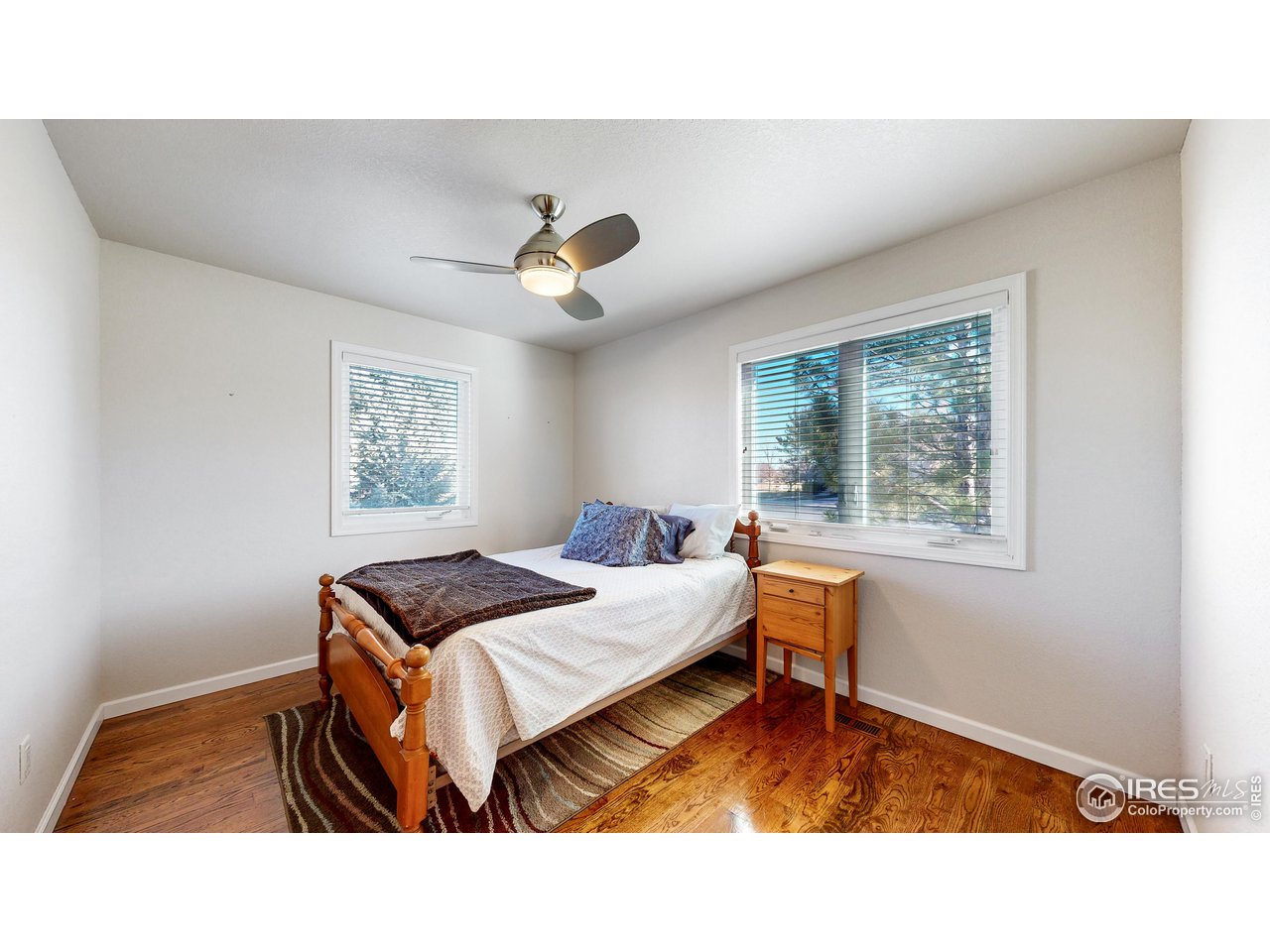 8368 Castaway Drive Windsor, CO 80528 - Photo 17 of 40 Recently added main level en-suite bedroom or main level primary located just off of the attached den/office/living space. New windows in this portion