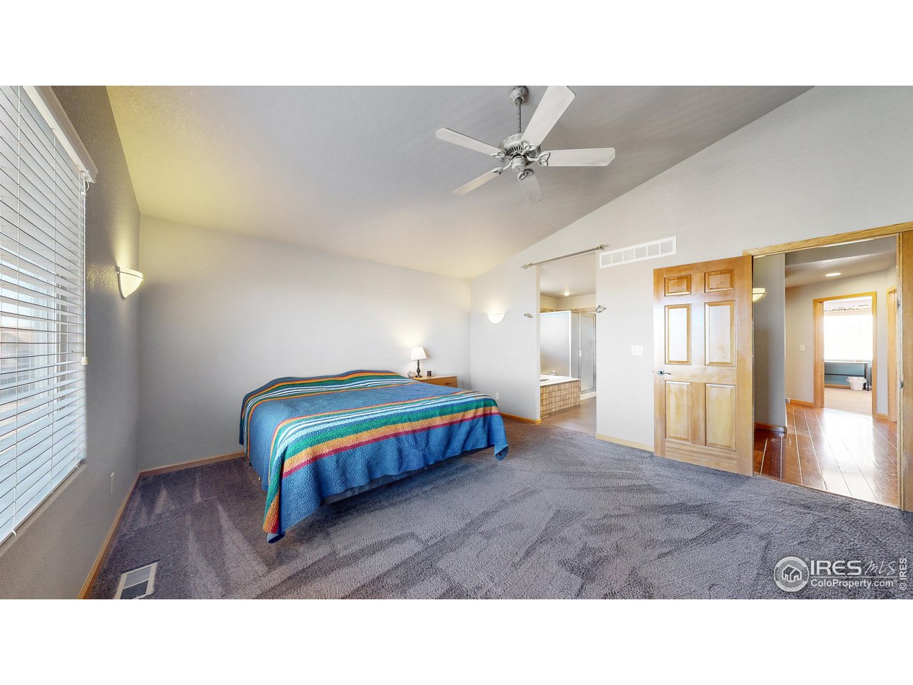 8368 Castaway Drive Windsor, CO 80528 - Photo 20 of 40 Upstairs spacious primary en-suite and high vaulted ceilings and easy access to primary ensuite bathroom