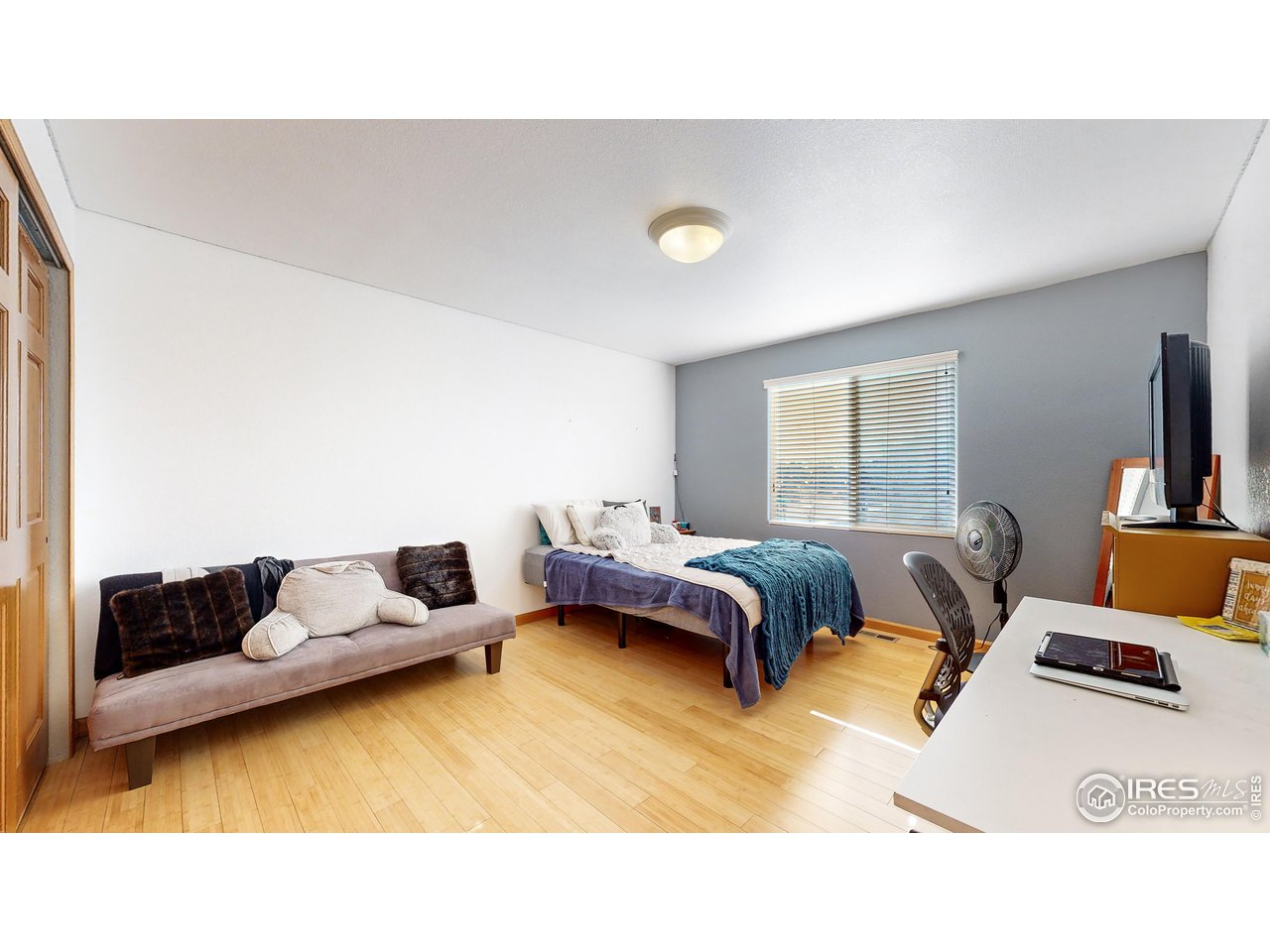 8368 Castaway Drive Windsor, CO 80528 - Photo 24 of 40 Huge upstairs bedroom #3 with laminate wood flooring. Solid core doors in all bedrooms NEW CARPET ON ORDER!