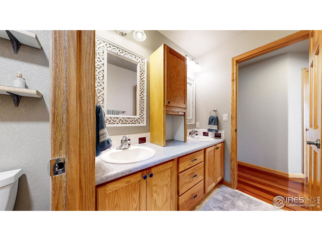 8368 Castaway Drive Windsor, CO 80528 - Photo 25 of 40 Generous sized shared full bathroom upstairs with double sink and separate water closet area