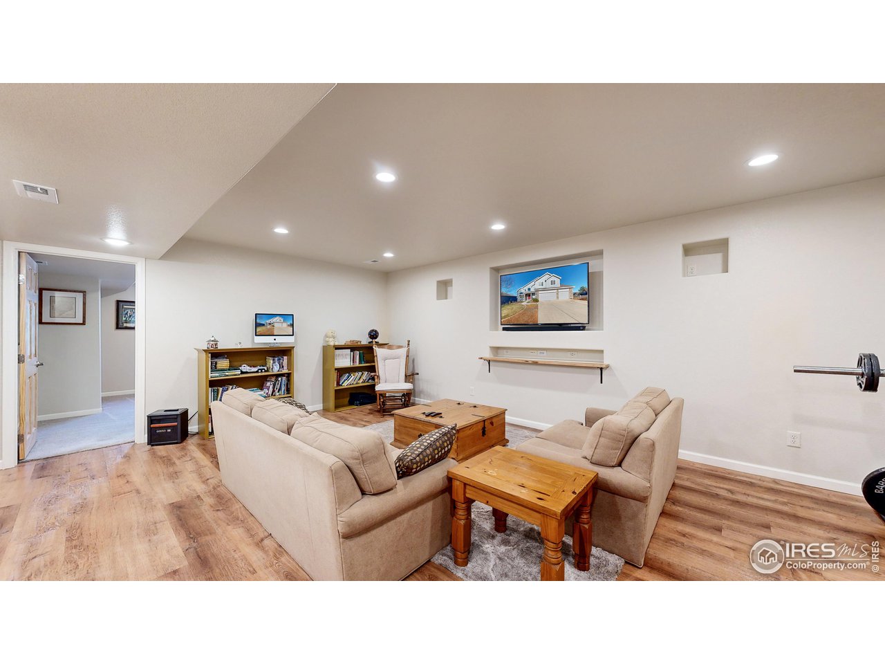 8368 Castaway Drive Windsor, CO 80528 - Photo 26 of 40 Head down to the great basement rec space with endless options for utilizing the space! Professionally finished in 2019