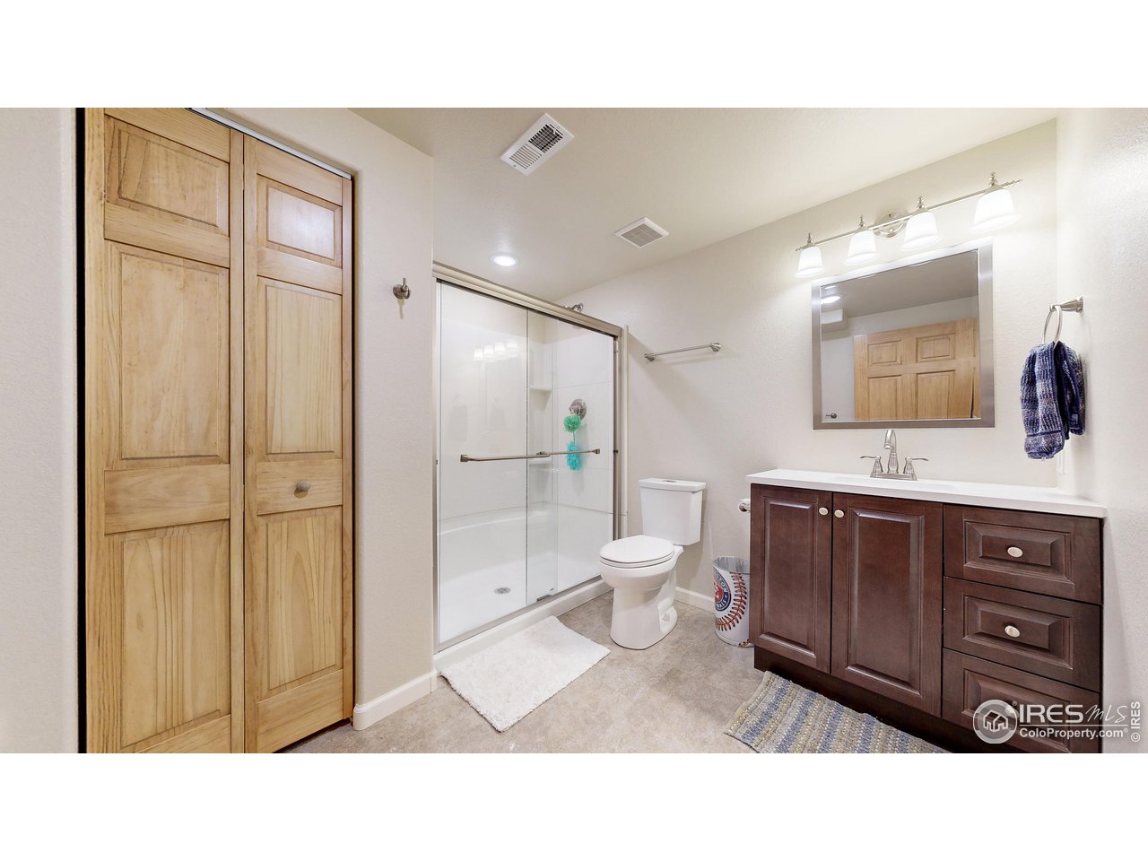 8368 Castaway Drive Windsor, CO 80528 - Photo 30 of 40 Beautifully finished 3/4 bathroom in basement with additional linen storage