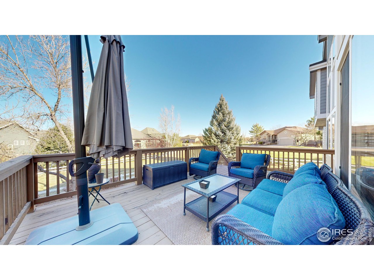 8368 Castaway Drive Windsor, CO 80528 - Photo 35 of 40 Expansive deck space looking over large yard and open green space!